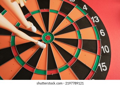 Long Legs Of The Legendary Doll In Sneakers On A Dart Board, Steps To Success Concept, The Path To Success Concept Sports Mood, To The Point, Go To The Goal, Achieve Success