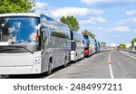 A long line of buses at the border waiting to cross.jpg