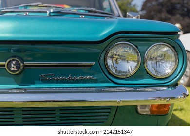 Long Melford Suffolk UK - 7 18 2021: turquoise Rootes Sunbeam Imp detail of front headlights