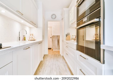 Long narrow kitchen with kitchen units on both sides