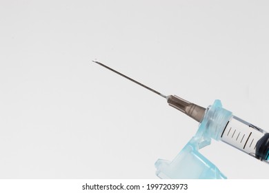 Long needle and syringe isolated on white background