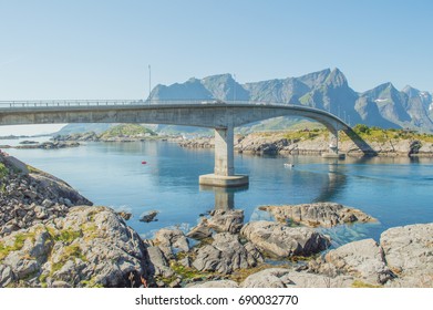 Long One Way Bridge With Reflection In The Water