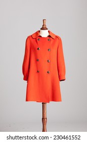 Long Orange Cashmere Women Coat With Wood Model On Grey Isolated