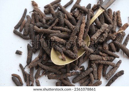 Long pepper on a white background