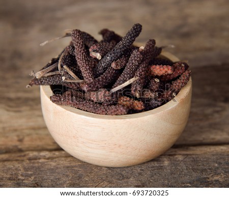 Long pepper or Piper longum on wooden table