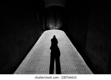 Long Person Shadow In The Corridor With Perspective View In Black And White