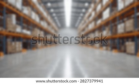 A long perspective view down the aisle of a large industrial warehouse filled with tall shelves stacked high with cardboard boxes.
