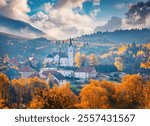 Long phocus picture of Catholic church of St. Michael the Archangel. Picturesque autumn scene of Valaska Dubova, village and municipality in Ruzomberok District in the Zilina Region of Slovakia.