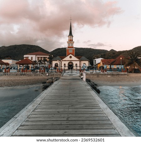 Long pier of the little town of Les Anses-d'Arlet, Martinique. Vibrant and magnificent Caribbean colors. French overseas department, French Antilles aka French West Indies
