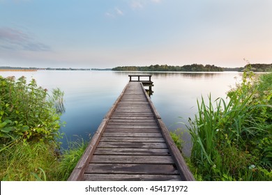 long pier on lake and blue sky in summer - Powered by Shutterstock