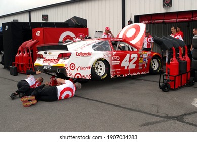 Long Pond, PA, USA - August 2, 2014:  NASCAR driver Kyle Larson's crew prepares his car for practice for the 2014 NASCAR Go Bowling 400 at Pocono Raceway in Pennsylvania.