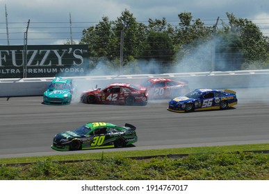 Long Pond, PA, USA - August 4, 2013:  NASCAR Driver Ricky Stenhouse Jr. Spins And Triggers A Crash During The 2013 NASCAR Go Bowling.com 400 At Pocono Raceway In Pennsylvania.	