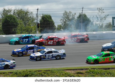 Long Pond, PA, USA - August 4, 2013:  NASCAR Drivers Crash During The 2013 NASCAR Go Bowling.com 400 At Pocono Raceway In Pennsylvania.