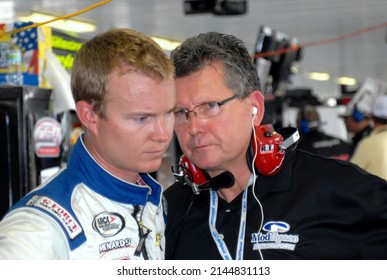 Long Pond, PA, USA - August 5, 2011: Race Driver Chad McCumbee (left) Gets Advice From Car Owner Andy Belmont During An ARCA Racing Series Event At Pocono Raceway In Pennsylvania.