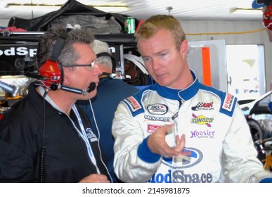 Long Pond, PA, USA - August 5, 2011: Race Driver Chad McCumbee (right) Talks With Team Owner Andy Belmont During An ARCA Racing Series Event At Pocono Raceway In Pennsylvania.