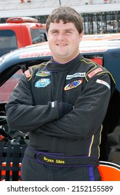 Long Pond, PA, USA - August 4, 2012: Race Driver Bryan Silas Awaits The Start Of A NASCAR Camping World Truck Series Race At Pocono Raceway In Pennsylvania.					