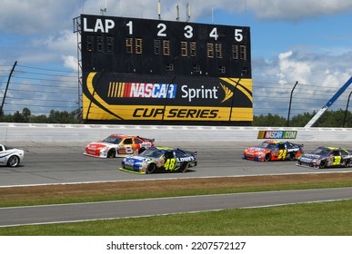 Long Pond, PA, USA - August 3, 2008: Cars Prepare To Take The Green Flag To Start A NASCAR Cup Series Event At Pocono Raceway In Pennsylvania. Cars Slightly Blurred To Show Speed.