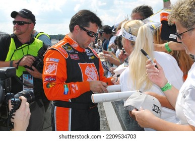 Long Pond, PA, USA - August 1, 2008: Race Driver Tony Stewart Signs Autographs During A NASCAR Cup Series Event At Pocono Raceway In Pennsylvania.