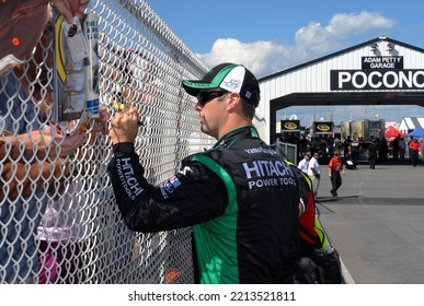 Long Pond, PA, USA - August 1, 2008: Race Driver Travis Kvapil Signs Autographs Prior To Qualifying For A NASCAR Cup Series Event At Pocono Raceway In Pennsylvania.