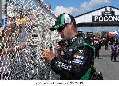 Long Pond, PA, USA - August 1, 2008: Race Driver Travis Kvapil Signs Autographs Prior To Qualifying For A NASCAR Cup Series Event At Pocono Raceway In Pennsylvania.