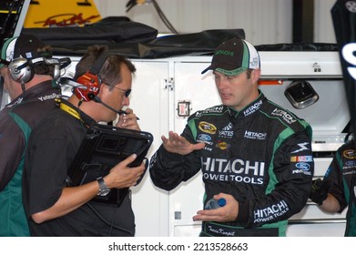 Long Pond, PA, USA - August 1, 2008: Race Driver Travis Kvapil (right) Confers With Crew Members During Practice For A NASCAR Cup Series Event At Pocono Raceway In Pennsylvania.