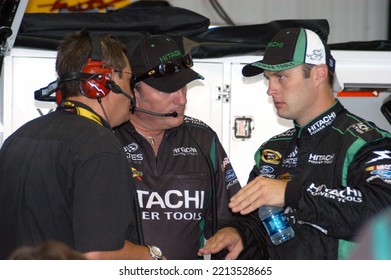 Long Pond, PA, USA - August 1, 2008: Race Driver Travis Kvapil (right) Confers With Crew Members During Practice For A NASCAR Cup Series Event At Pocono Raceway In Pennsylvania.