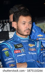 Long Pond, PA, USA - July 27, 2019:  NASCAR driver Kyle Larson relaxes between practice sessions for the 2019 NASCAR Gander RV 400 at Pocono Raceway in Pennsylvania.