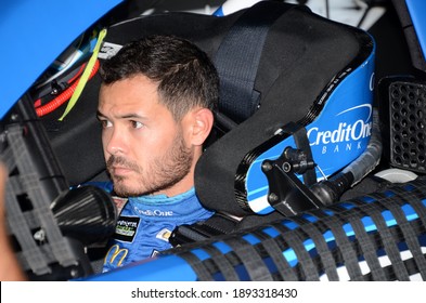Long Pond, PA, USA - July 27, 2019:  NASCAR driver Kyle Larson sits in his car during practice for the 2019 NASCAR Gander RV 400 at Pocono Raceway in Pennsylvania.