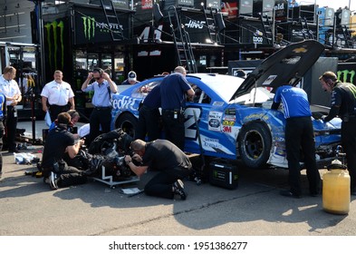 Long Pond, PA, USA - July 27, 2019:  Crewmen repair NASCAR driver Kyle Larson's race car after a crash during practice for the 2019 NASCAR Gander RV 400 at Pocono Raceway in Pennsylvania.