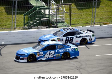 Long Pond, PA, USA - July 28, 2019:  NASCAR drivers Kyle Larson (42) and Alex Bowman race each other during the 2019 NASCAR Gander RV 400 at Pocono Raceway in Pennsylvania.