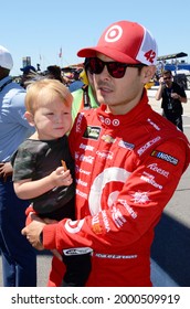 Long Pond, PA, USA - July 30, 2017:  NASCAR driver Kyle Larson and his son await the start of the 2017 Overton's 400 at Pocono Raceway in Pennsylvania.