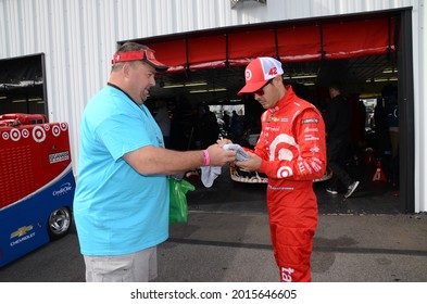 Long Pond, PA, USA - July 29, 2017:  NASCAR driver Kyle Larson signs autographs following practice for the 2017 Overton's 400 at Pocono Raceway in Pennsylvania.
