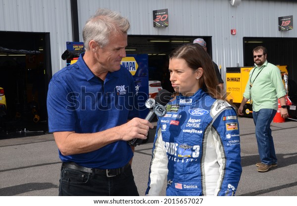 Long Pond, PA, USA - July 29, 2017:  Former\
NASCAR driver turned broadcaster Kenny Wallace interviews Danica\
Patrick following practice for the 2017 Overton\'s 400 at Pocono\
Raceway in Pennsylvania.
