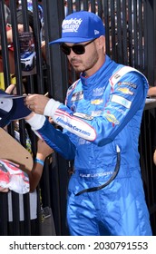 Long Pond, PA, USA - June 27, 2021:  NASCAR driver Kyle Larson signs autographs before the start of the 2021 NASCAR Explore the Pocono Mountains 350 Cup Series race at Pocono Raceway in Pennsylvania