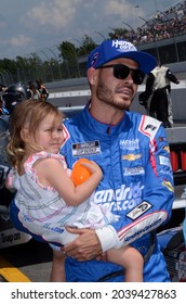 Long Pond, PA, USA - June 27, 2021:  NASCAR driver Kyle Larson and his daughter await the start of the 2021 NASCAR Explore the Pocono Mountains 350 Cup Series race at Pocono Raceway in Pennsylvania.