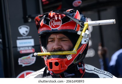 Long Pond, PA, USA - June 27, 2021:  A NASCAR Crewman Wears A Special Helmet That Holds A Track Bar Adjustment Tool During A NASCAR Xfinity Series Race At Pocono Raceway.