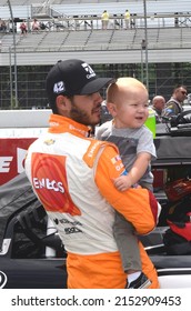 Long Pond, PA, USA - June 4, 2016: Race driver Kyle Larson and his son await the start of a NASCAR Xfinity race at Pocono Raceway in Pennsylvania.