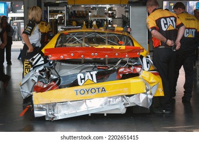 Long Pond, PA, USA - June 10, 2007: Dave Blaney's Wrecked Race Car Sits In The Garage Following A Practice Crash During A NASCAR Cup Series Event At Pocono Raceway In Pennsylvania.