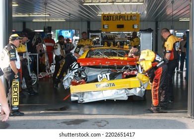 Long Pond, PA, USA - June 10, 2007: Dave Blaney's Wrecked Race Car Sits In The Garage Following A Practice Crash During A NASCAR Cup Series Event At Pocono Raceway In Pennsylvania.