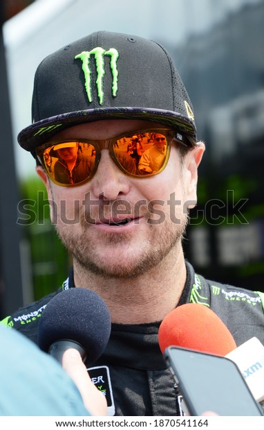 Long Pond, PA, USA - June\
1, 2019:  NASCAR driver Kurt Busch gets interviewed after\
qualifying for the 2019 NASCAR Pocono 400 at Pocono Raceway in\
Pennsylvania.