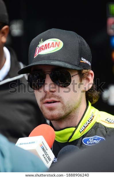 Long Pond, PA, USA - June\
1, 2019:  NASCAR driver Ryan Blaney gets interviewed after\
qualifying for the 2019 NASCAR Pocono 400 at Pocono Raceway in\
Pennsylvania.