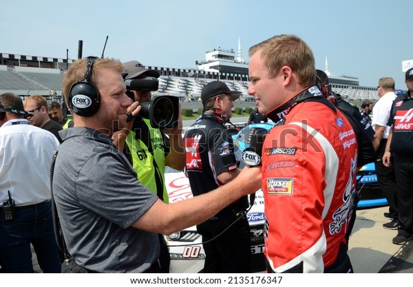 Long Pond, PA, USA - June 1,\
2019: Race driver Cole Custer gets interviewed before the start of\
a NASCAR Xfinity race at Pocono Raceway in\
Pennsylvania.