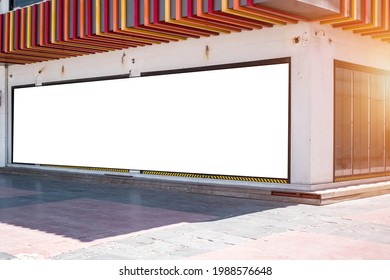 Long promotion blank banner on wall of city mall or store over empty sidewalk. Announcement and marketing concept. - Shutterstock ID 1988576648