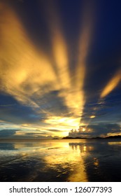 The long ray of sunset with reflection.