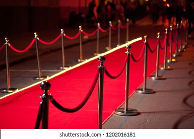 Long Red Carpet Between Rope Barriers On Entrance.