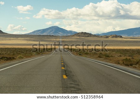 Long road in america with mountain and cloud sky view