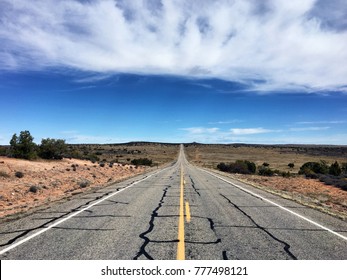 Long road extends far off into the horizon