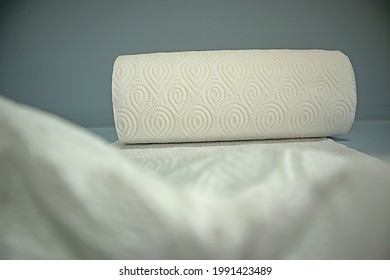 A Long Roll Of White Tissue On A White Background. 