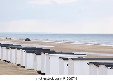 A long row of beach huts