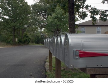 A long row of mail boxes outside this new apartment complex